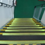 Old worn anti-slip stair treads on ship