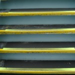 Old worn anti-slip stair treads on ship